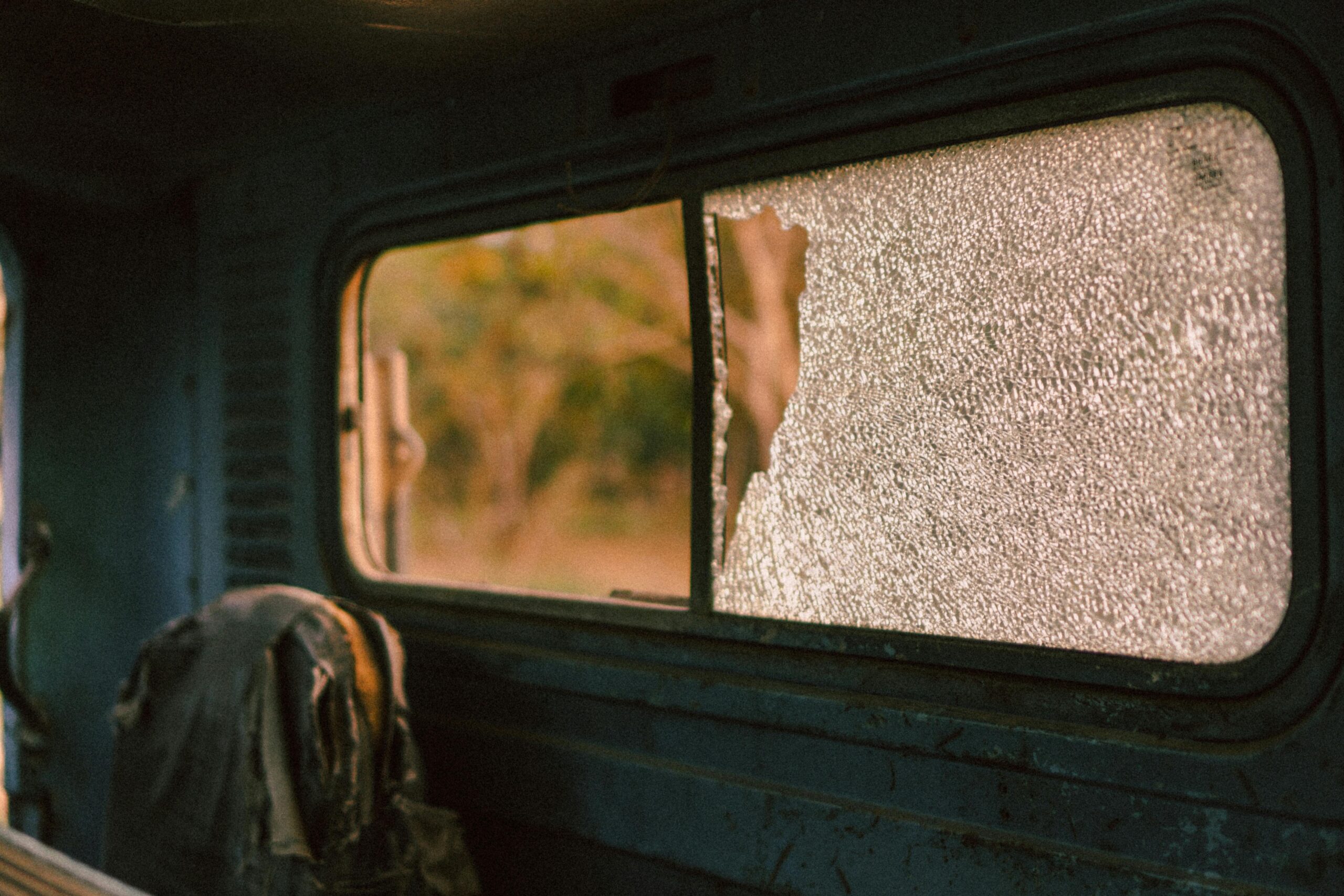 A damaged car window caused by vandalism