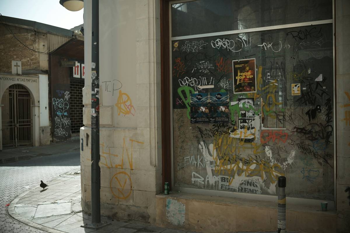 Side-by-side images of a vandalized store window before and after repairs