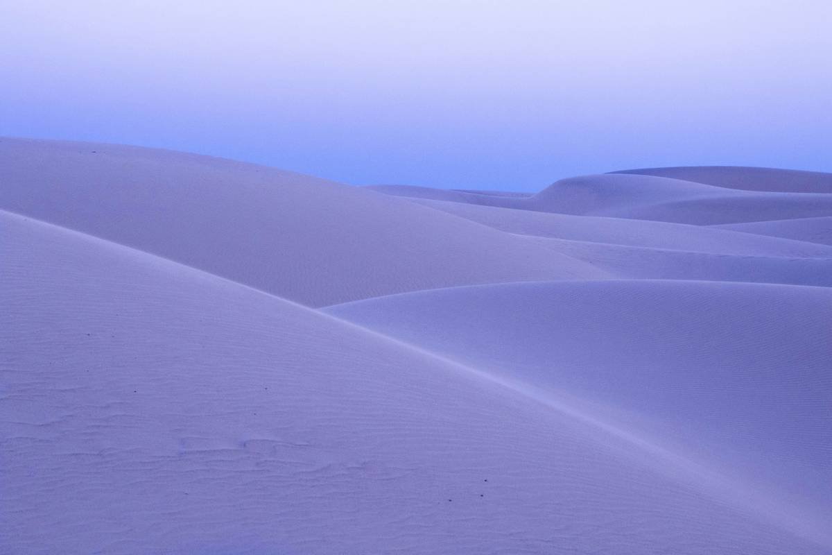 I caught last light just after sunset during the blue hour. During the right season or during a full moon does the whole place light up with a blueish and purple glow