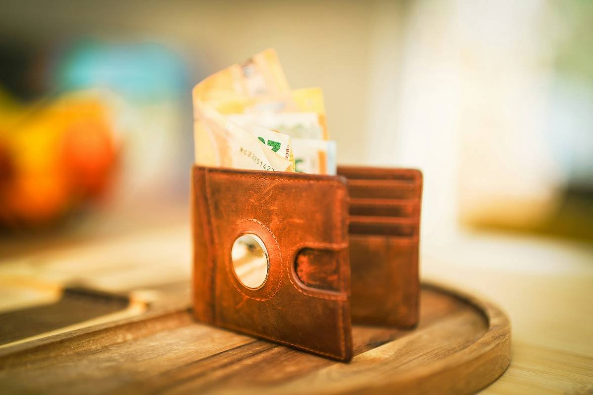 money wallet on wooden table home interior